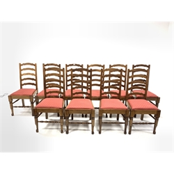 Set of twelve oak waved ladder back dining chairs with drop in upholstered seat pads and turned front supports and stretchers, W50cm