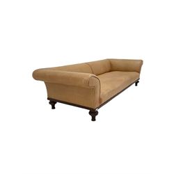 Victorian style low sofa, upholstered in beige leather, raised on turned feet, one bearing a 'Holland & Sons' stamp W225cm