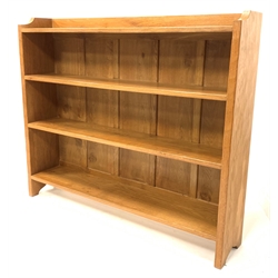 'Eagleman' oak open bookcase, with adzed and shaped panel end supports supporting three shelves, W127cm, H107cm,  D25cm