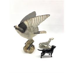Spode bisque model of an osprey H29cm, Beswick black Labrador and a biscuit porcelain model of a Hunting dog marked Triade beneath (3)