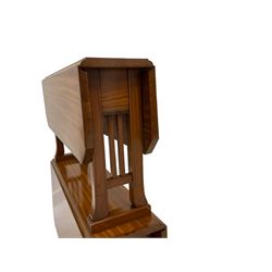 Edwardian two-tier satinwood Sutherland table or etagere, the rectangular crossbanded drop-leaf tops with canted corners and ebony stringing, splayed square shaped end supports and inner gates on castors