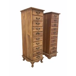Two 20th century hardwood tall chests fitted with ten drawers, W41cm, H136cm, D46cm