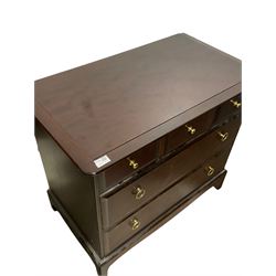 Stag Minstrel - mahogany chest of drawers, fitted with three short and two long drawers, raised on bracket supports 