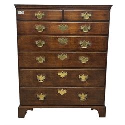 George III oak chest, rectangular top with moulded edge, fitted with two short over five long graduating drawers with brass handle plates and escutcheons, lower moulded edge on bracket feet