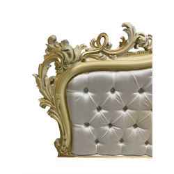 Italian classical or baroque style ivory painted 5' king-size divan surround, the headboard decorated with a central cartouche and extending scrolling with gilt and painted flowerheads and pierced foliate moulding, head and footboard upholstered in button ivory fabric