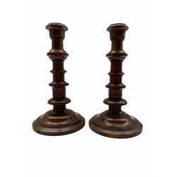 Pair of 18th century design yew wood candlesticks with ring turned columns and circular bases H21cm
