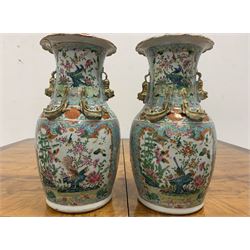 Pair of 19th century Chinese Canton Famille Rose vases, of baluster form with  overhanging scalloped rim, applied gilt Dog of Fo handles and Dragons, later converted to electricity, H36cm 