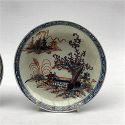 Four late 18th century porcelain tea bowls and saucers, probably Liverpool, painted in underglaze blue and iron red with The Long Bridge pattern, with extra saucer