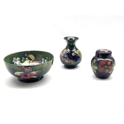 Moorcroft Orchid pattern bowl on green ground, D19cm and Moorcroft vase and ginger jar decorated in the Anemone pattern, impressed marks (3)