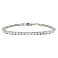 White gold round brilliant cut diamond line bracelet, stamped 18K, total diamond weight 7.20 carat