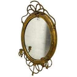 Victorian oval wall mirror with two candle sconces in a gilt frame with rope twist decoration