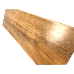 Late 20th century yew wood refectory style table, rectangular top raised on square supports united by a central stretcher