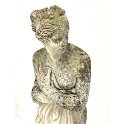 Classical weathered composite stone garden figure of a semi-nude woman, H117cm