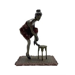 A cold painted bronze of a lady with her foot on a stool, in the manner of Bergman, stamped beneath, H13.5cm