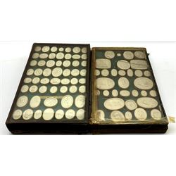 Collection of eighty six Grand Tour plaster intaglio seals of various shapes depicting classical figures, busts etc in two glazed cases one with an old paper label inscribed 'Opere de Luigi Pichler' (1773-1854) each case 33cm x 21cm