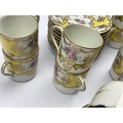  Nine Selb Bavarian coffee cans and ten saucers with floral sprays on a yellow and gilt ground  and six Wedgwood coffee coffee cups and saucers  