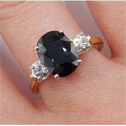 18ct gold three stone oval sapphire and diamond ring, hallmarked, sapphire approx 2.60 carat, total diamond weight approx 0.45 carat