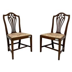 Pair of 19th century country elm dining chairs, shaped eared cresting rail over vertical pierced splat, upholstered drop-in seats, on chamfered supports united by plain stretchers (W50cm, H94cm); pair of George III walnut side chairs, arched cresting rail over scrolled and pierced splat, drop-in upholstered seat, square tapering supports united by plain stretchers; George III design tripod washstand, fitted with lidded urn shaped compartment over two small drawers, on three splayed supports (H86cm) (5)
Provenance: From the Estate of the late Dowager Lady St Oswald