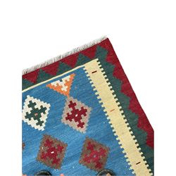 Kilim rug, light blue ground field decorated with multiple stepped lozenges, three geometric border bands