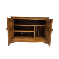Ercol - hi fi cabinet, with hinged lifting lid over two cupboard doors