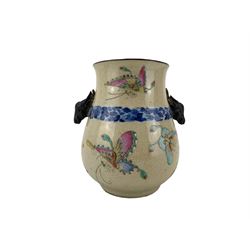 20th century Chinese crackle glaze Hu form vase, the body enamelled in the rose Canton style with Butterflies and painted with a blue and white foliate band, with twin deer mask handles, impressed seal mark beneath H15.5cm 