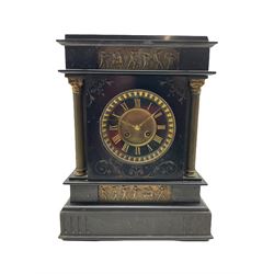 A Belgium slate mantle clock with a French striking movement c1880, flat top pediment and frieze beneath with two matching panels of brass repoussé work depicting scenes from Greek antiquity, with incised decoration and flanking reeded brass pillars with Corinthian capitals, two-part Belgium slate dial with a gilt centre, gold incised roman numerals and brass fleur de Lis hands, cast brass bezel with a flat bevelled glass and egg and dart slip, with an eight day movement striking the hours and half hours on a coiled gong. With pendulum.

