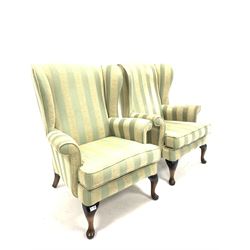 Pair of Queen Anne style wingback armchairs, upholstered in striped fabric, raised on cabriole front supports W76cm