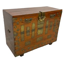 Early 20th century century Korean brass bound elm morijang or cabinet, fall-front cupboard enclosing three small drawers over large compartment, the brass fittings engraved with foliate patterns, with heavy brass lock in the form of a fish