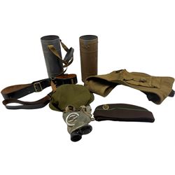 WWII French gas mask in original canister and an additional canister, webbing gun sling, Sam Browne belt, and two ATS caps (6)