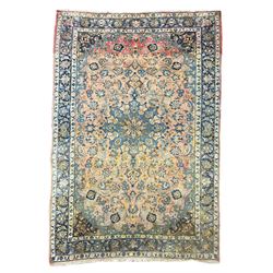 Antique Iranian Nanaj peach ground rug, the field decorated with a central indigo floral pole medallion, surrounded by scrolling interlacing palmettes and foliate decoration with matching spandrels, the triple band border with repeating foliate motifs