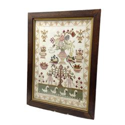 Victorian sampler worked in wool thread with Adam & Eve, Swans and Flowers within a trailing border, 'Hannah ? Work Aged 11, 1852' 46cm x 32cm 