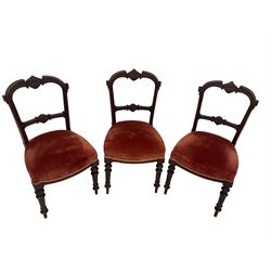 Set three late 19th century dining chairs, cresting rail carved with c-scrolls and Greek key design, middle rail with central foliate motif and extending scrolling, upholstered sprung seat raised on fluted turned supports 