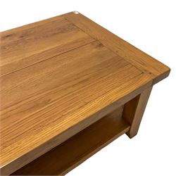 Light oak rectangular coffee table, square supports joined by under-tier 