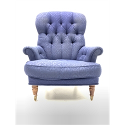 Liberty of London - Victorian style armchair, upholstered in deep buttoned blue damask fabric, raised on turned front supports and castors