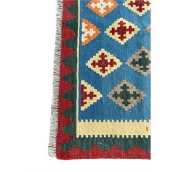 Kilim rug, light blue ground field decorated with multiple stepped lozenges, three geometric border bands