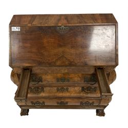 Early 20th century Dutch figured walnut bombe bureau, fall-front enclosing fitted interior with central cupboard flanked by pigeonholes and correspondence drawers with two secret drawers, over pen drawer stays and three graduating long drawers, lower moulded edge above ball and claw feet