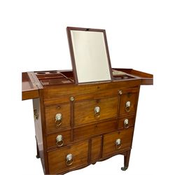 Regency mahogany washstand, with pivoting hinged lid above an arrangement of small drawers with lion mask loop handles