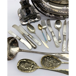 Sterling silver gilt heart shaped tea caddy spoon by R. Wallace & Sons, Norwegian silver-gilt and enamel coffee spoon by David Andersen, Norwegian silver tablespoon stamped 830s, American Sterling silver butter knife with pierced foliate handle,  MFG. silver baby spoon and fork, various mother-of-pearl handled tea knives, Ives MFG silver-plated ladle, plated oval fruit dish and a pair of plated candlesticks etc