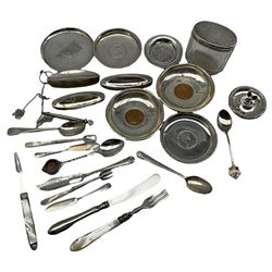 Group of silver, to include pair of Edwardian dishes with inset coins, wax holder with oblique gadrooned rim, three silver mounted buffers, small group of flatware to include George III and later pieces, small pin dish decorated with calligraphic script, probably Egyptian, three white metal dishes, etc. 
