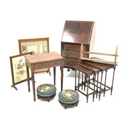 Edwardian mahogany bureau, fire screen with needle work panel, another fire screen, small Edwardian mahogany table with drawer and hinged compartment, early 20th century nest of three tables, two footstool and a book trough (7)