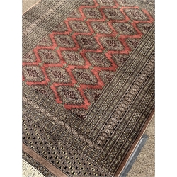 Persian Bokhara design rug, field decorated with Guls, multiple border with geometric motifs, 186cm x 128cm