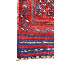 Meshwani indigo and maroon runner rug, the field decorated with connecting lozenges with ivory details, the border with stylised spiral waves, the short edges with indigo stripes