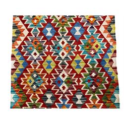 Chobi Kilim multi-colour rug, the field decorated with all-over geometric lozenges with ivory outlines, the long edges with amber outer bands