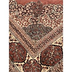 Persian design ground rug, lobed central medallion on deep red field with trailing foliate, and boarder 273cm x 360cm 