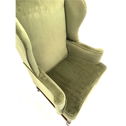 20th century Georgian style wing back armchair upholstered in green fabric, W79cm