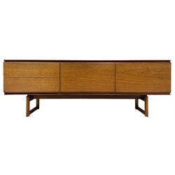 White & Newton Ltd. - teak sideboard, two drawers, central fall front and cupboard, on open rectangular framed supports