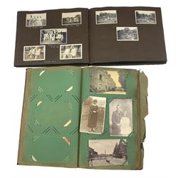 Post card album and contents of vintage cards and a photograph album and contents (2)