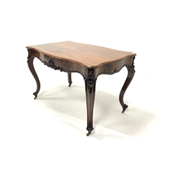Early 19th century figured mahogany centre table, serpentine top, frieze drawer with shaped apron and applied floral decoration, raised on scrolled cabriole supports terminating in brass castors, 125cm x 76cm, H78cm
