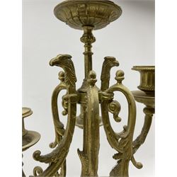 Pair late 19th century six branch table candelabra, the branches cast with Griffon heads and ornate foliate scrolls, the central column of polished marble segments mounted by cherubs adorning each side united by foliate garlands, stepped base decorated with flower head patterned drapery, on four splayed paw cast feet H70cm (2)