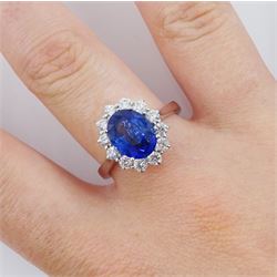 18ct white gold oval cut sapphire and round brilliant cut diamond cluster ring, hallmarked, sapphire approx 3.85 carat